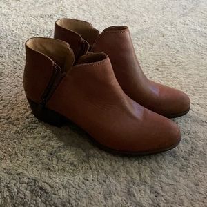 Not sure on the brand. Light brown leather material.